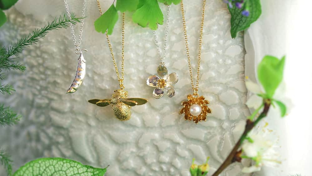 Peapod, Bumblebee, flower and chrysanthemum necklaces.